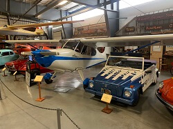 WAAAM's Aeronca 15AC Sedan on display next to a video on the record-breaking-similar airplane The City of Yuma.