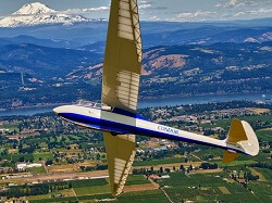 WAAAM's 1951 Heini Dittmar Condor IV flying over Hood River with Mt. Adams in the background.