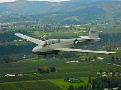 WAAAM's WWII Schweizer TG-3 training glider flying over the Hood River valley. 