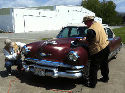 WAAAM's 1953 Kaiser Manhattan getting polished before going on display in the museum.