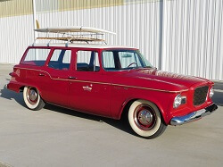 WAAAM's 1960 Studebaker Lark ready to hit the beach with surfboard on the rack. 