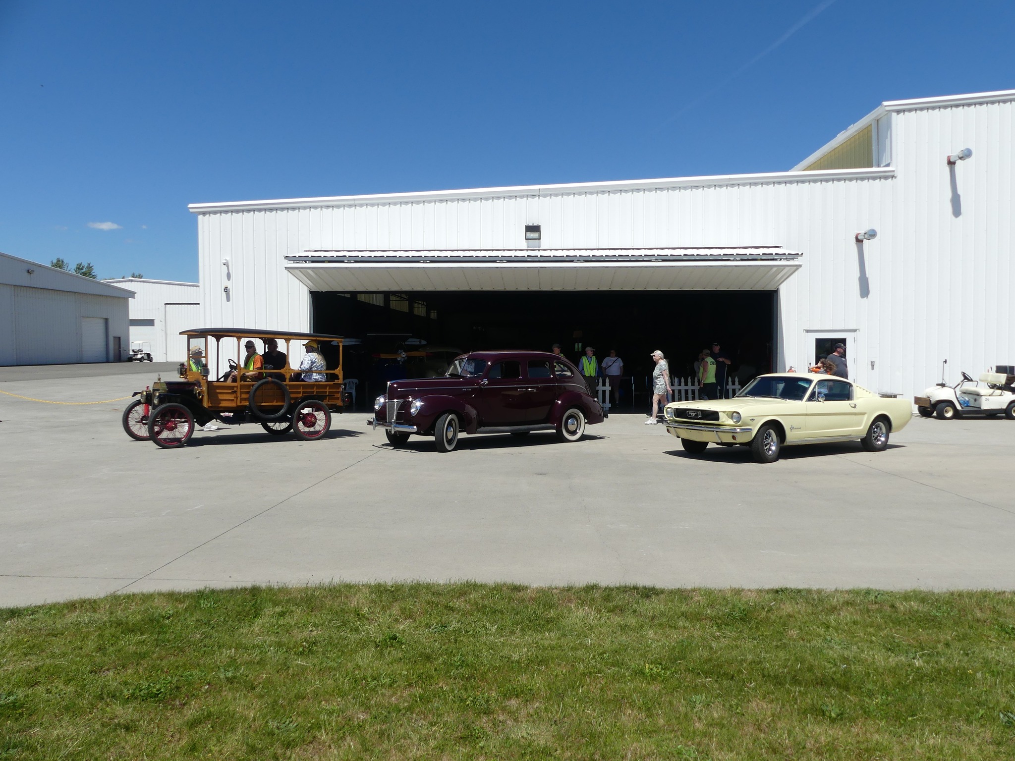 cars outside of hangar about to do rides on a second saturday